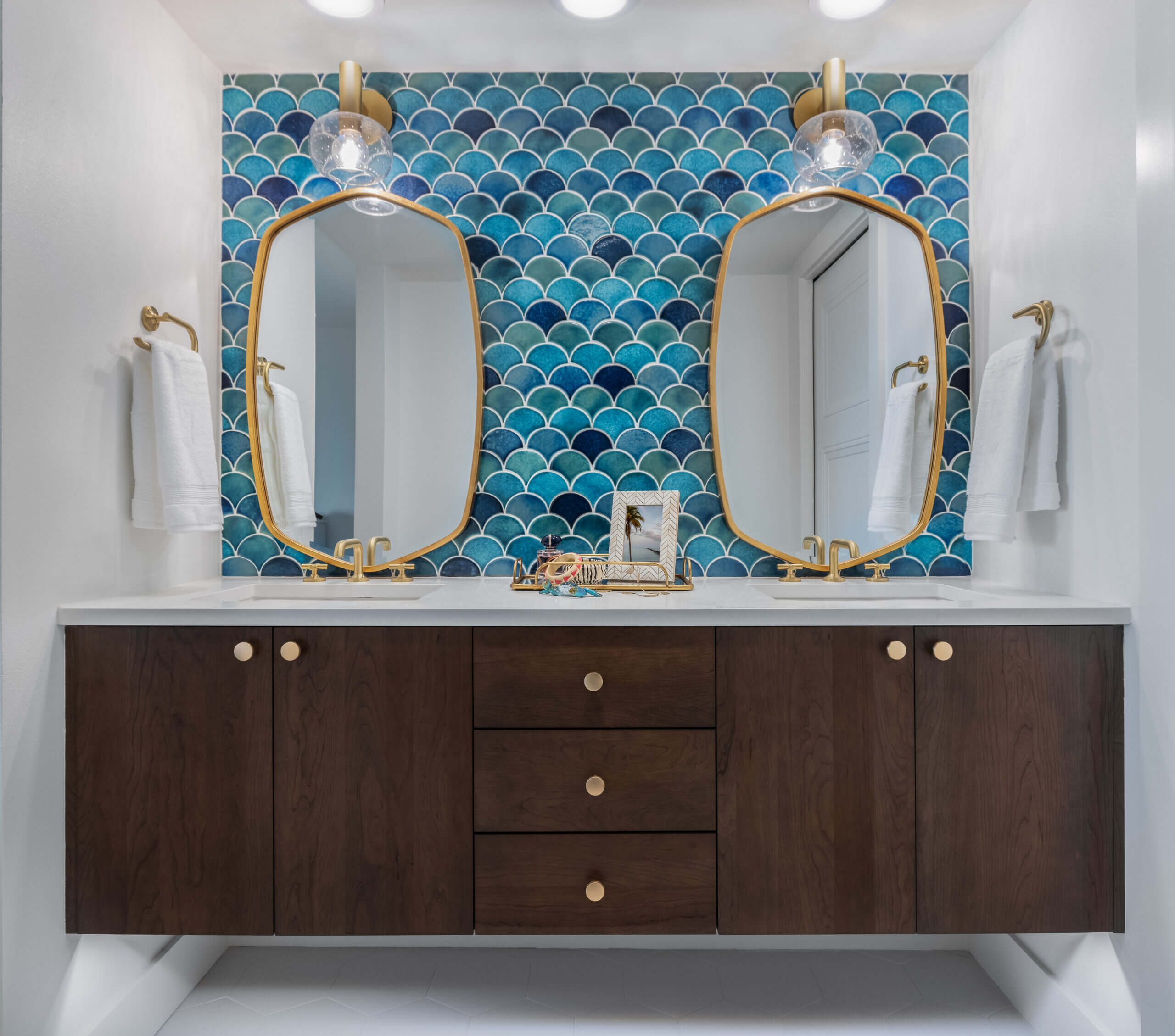 orange moon interiors master bathroom with gold mirror