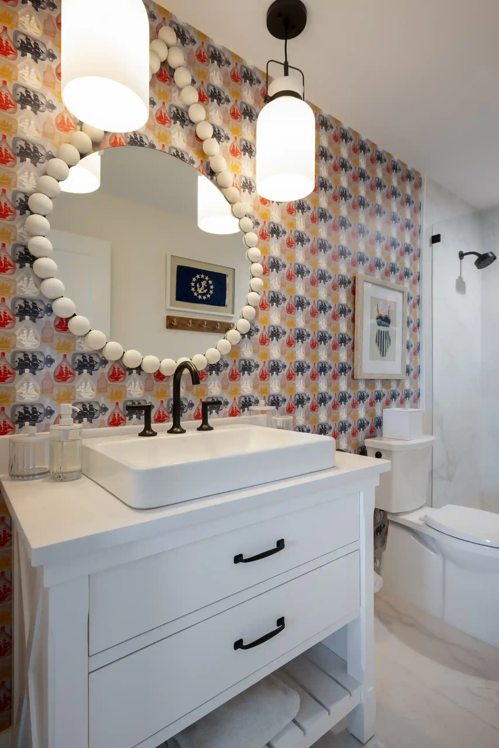 nice design of a bathroom with printed wall paper by orange moon interiors