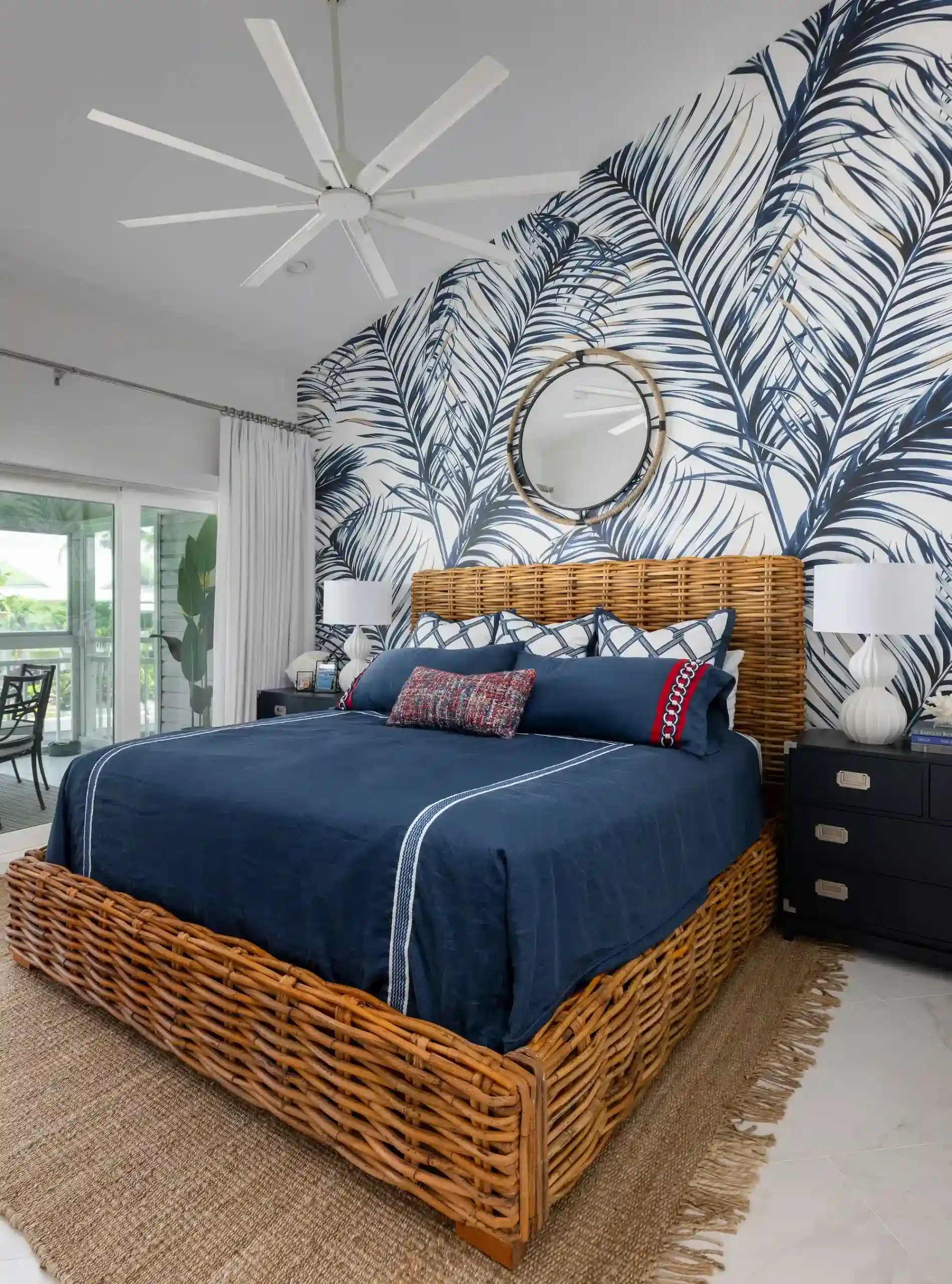 unique design of bedroom with rattan bed by luxury home decorator in fl Orange Moon Interiors