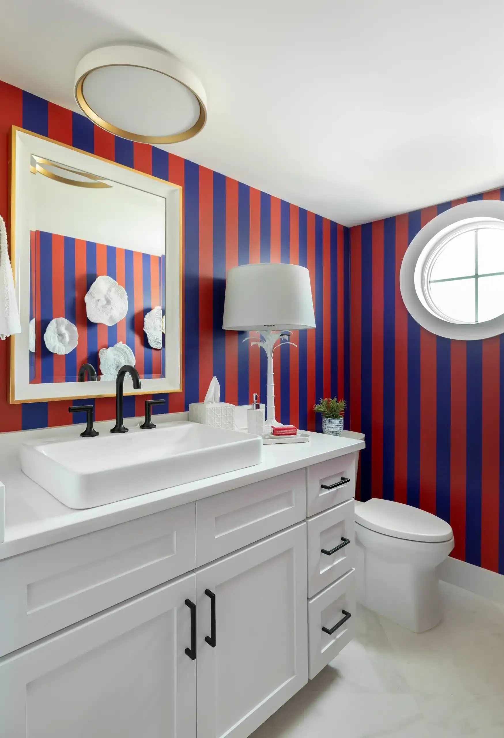 red and blues stripe wall design of a bathroom by orange moon